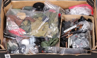 Action Man by Palitoy, a quantity of uniforms including, trousers, weapons, boots, etc, all contained in a fruit box 