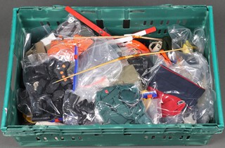 A large collection of Action Man clothing and equipment contained in a blue plastic box 