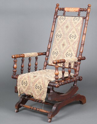 A 19th Century turned beech rocking chair with bobbin turned decoration 108cm h x 52cm w x 53cm d 