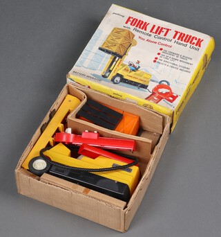 A Palitoy fork lift truck with remote control hand unit, boxed