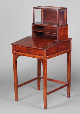 A pine framed Davenport, the upper section with associated glazed cabinet, raised on square tapered supports 122cm h x 56cm w x 57cm d 