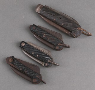 Four Army issue pocket knives