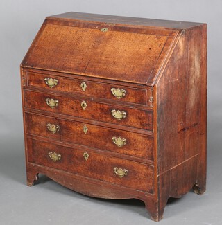 A Georgian oak bureau (with plywood replacement back), the interior fitted a cupboard, pigeon holes and 6 drawers, the base fitted 4 drawers, raised on bracket feet with swan neck drop handles 101cm h x 100cm w x 49cm d 