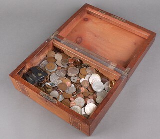 A Victorian work box with a quantity of minor coins