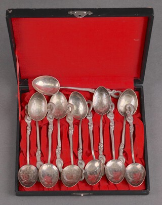 Twelve cased Japanese teaspoons with snake stems 