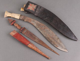 A Kukri style dagger with horn handle and an African dagger