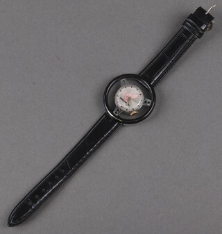 A gentleman's steel and plastic cased Honda wristwatch in the form of a steering wheel on a leather strap 