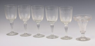 A 19th Century engraved wine glass with vinous decoration and tapered stem 13cm and 5 Edwardian engraved wine glasses with floral decoration 
