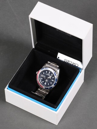 A gentleman's steel cased Seiko 5 sports day date wristwatch on a ditto bracelet, boxed