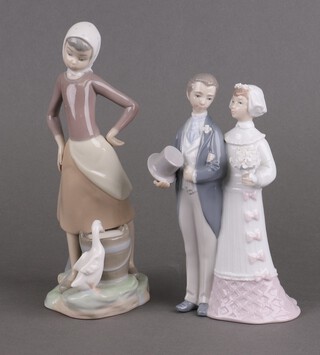 A Lladro group of a bride and groom 4308 21cm and a girl with a goose 26cm 