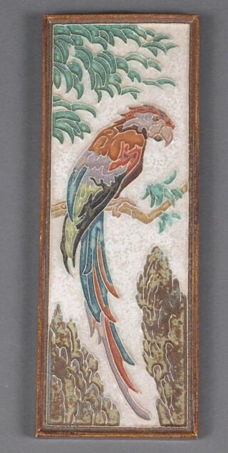 A Delft porcelain plaque decorated with a bird 33.5cm 