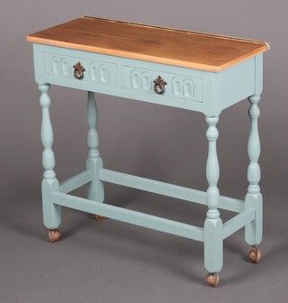 A turquoise painted oak side table fitted 2 drawers raised on turned supports with shepherd casters 76cm h x 75cm w x 31cm d 