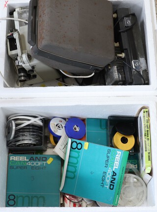 Three projectors and a quantity of film spools