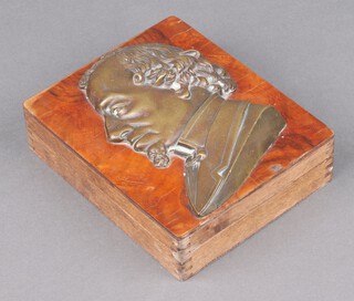 A rectangular cedar box, the lid with bronzed portrait plaque of Charles Dickens 4cm x 14cm x 17cm, the base impressed Muhlhansel & Co., Triesch 