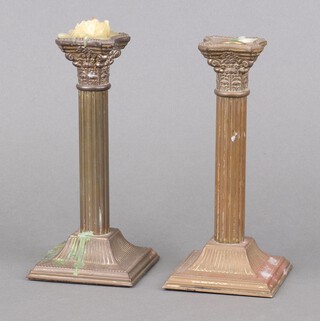 A pair of 20th Century gilt metal reeded candlesticks with Corinthian capitals, on square bases 21cm h x 9cm 