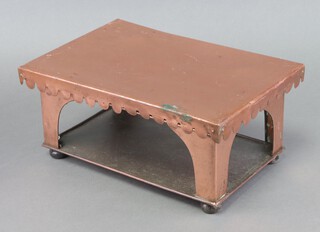 A 19th Century rectangular copper hot plate with wavy border, raised on 4 turned wooden feet 16cm h x 36cm w x 24cm d 