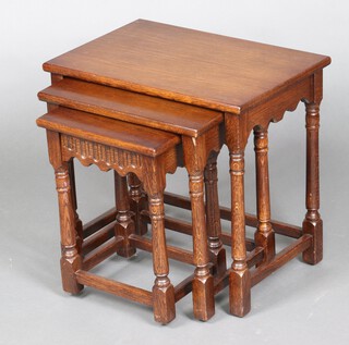 A nest of 3 mahogany coffee tables on turned and block supports 48cm h x 51cm w x 35cm d 