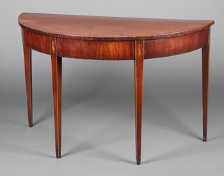 A 19th Century demi-lune crossbanded mahogany side table, inlaid shells to the top of the legs, raised on 4 square tapered supports 76cm h x 122cm w x 55cm d (formerly a section of a dining table) 