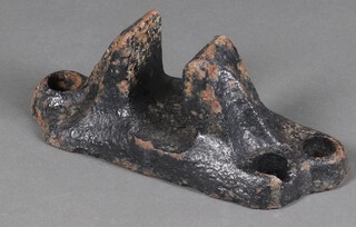 A 19th Century iron railway line shoe, unmarked, 15cm x 36cm x 15cm together with a signal housing 