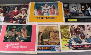 A collection of cinema foyer cards/posters