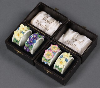 A set of four Royal Doulton napkin rings (boxed)