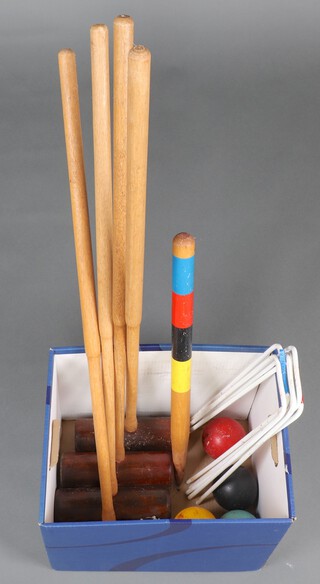 A croquet set comprising 4 mallets, 6 hoops, peg and 4 balls 