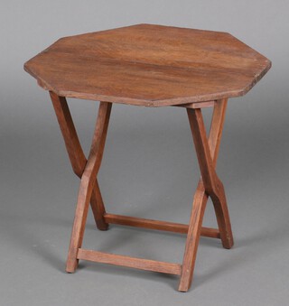 A 1930's octagonal oak coaching table with X framed supports 53cm h x 56cm w x 55cm d 