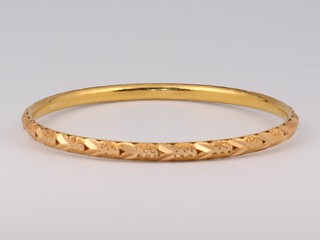 A yellow gold, testing as 22ct bright cut bracelet, the interior 6cm, 10 grams 