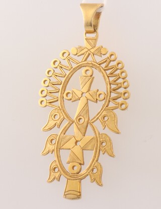A yellow gold, testing as 18ct, pierced pendant 15 grams 
