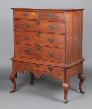 An 17th Century oak chest on stand with moulded top, fitted 2 short and 2 long drawers, the base fitted 1 long drawer, raised on cabriole supports 132cm h x 97cm w x 54cm d 