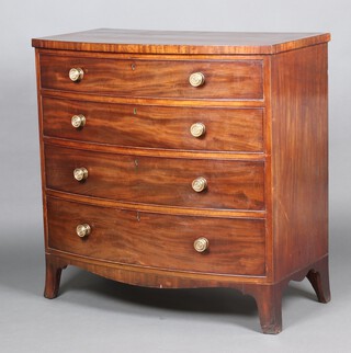 A Georgian bow front mahogany and crossbanded chest of 4 drawers with brass handles, raised on splayed bracket feet 107cm h x 108cm w x 59cm d 