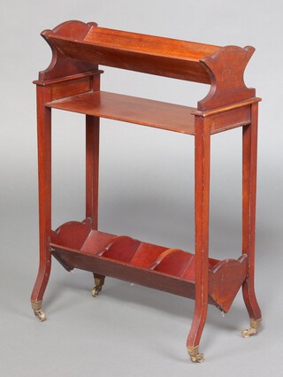An Edwardian rectangular mahogany 2 tier book trough, the upper section fitted a book trough above a shelf, the base fitted a 3 division trough, on brass caps and casters 74cm h x 54cm w x 22cm d 