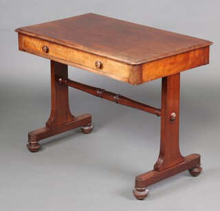 A Victorian mahogany library/side table fitted a frieze drawer, raised on standard end supports with bun feet 71cm h x 91cm w x 56cm d 