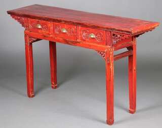 A 19th Century Chinese carved red lacquered altar table, fitted 3 drawers, raised on square tapered supports 87cm h x 152cm w x 40cm d 