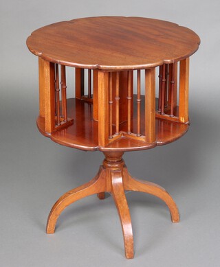 An Edwardian circular mahogany 2 tier revolving bookcase, raised on a turned column and tripod base 70cm h x 59cm diam. 