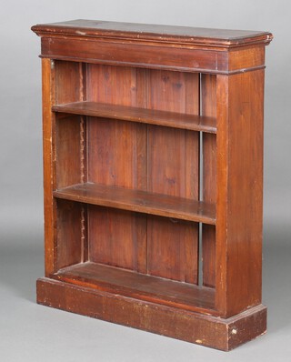 A Victorian pine and mahogany open bookcase fitted adjustable shelves, raised on a platform base 109cm h x 91cm w x 26cm d 