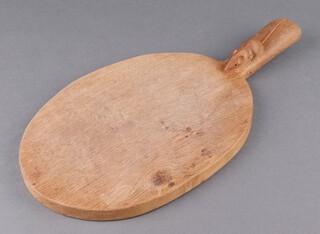 Robert "Mouseman" Thompson of Kilburn, a carved oak cheeseboard, the handle carved a mouse 40cm x 20cm 