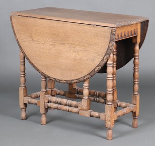 A Victorian carved bleached oak drop flap gateleg tea table, the rim carved leaves and the apron with arcaded decoration, raised on turned and block supports 73cm h x 85cm w x 36cm 