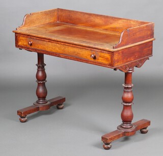 A William IV bleached mahogany dressing table with 3/4 gallery, raised on bulbous turned supports with bun feet 88cm h x 100cm w x 51cm d 