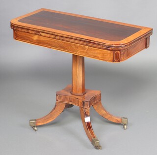 A Regency rosewood and crossdbanded satinwood D shaped card table, raised on a chamfered column, triform base and splayed feet with brass caps and casters 75cm h x 89cm w x 43cm d 