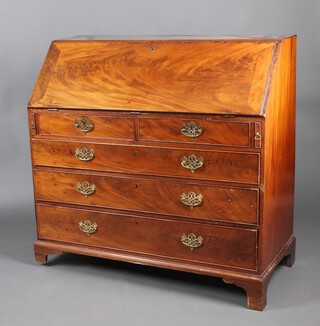 A Georgian bleached mahogany bureau, the fall front revealing a well fitted interior with drawers, cupboard and pigeon holes, above 2 short and 2 long drawers with brass escutcheons and replacement handles, 107cm h x 110cm w x 54cm d 