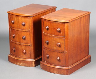 A pair of Victorian mahogany bow front bedside chests of 3 drawers with turned handles (formerly part of a dressing table), raised on a platform base 62cm h x 40cm w x 55cm d 