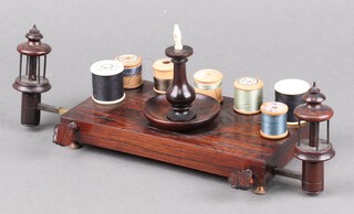 A Victorian rosewood and bone rectangular bobbin stand, the sides fitted adjustable bobbin winders 13cm x 21cm x 11cm