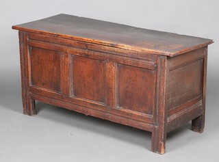 A 17th Century oak coffer of panelled construction with hinged lid and original hinges, 64cm h x 132cm w x 53cm d 