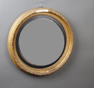 A Georgian convex plate wall mirror contained in a decorative gilt plaster frame with wreath decoration 63cm diam. 