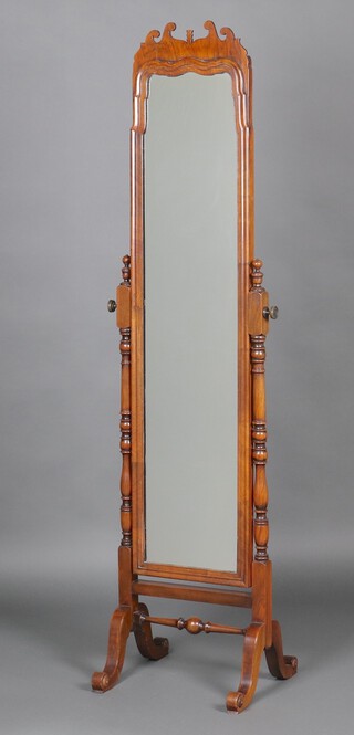 A Queen Anne style arched plate cheval mirror contained in a walnut frame 180cm h x 45cm w x 40cm d