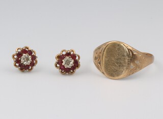 A gentleman's 9ct yellow gold signet ring (cut) and a pair of 9ct yellow gold garnet ear studs, 5.2 grams gross 