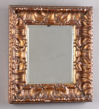 A 19th Century rectangular bevelled plate wall mirror contained in a carved gilt wood frame 44cm x 40cm 