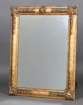 A 19th Century Continental rectangular plate mirror contained in a gilt plaster and wooden frame 94cm x 74cm, the back of the mirror marked Maison Derche Paris