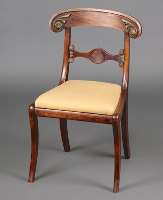 A 19th Century Continental carved walnut bar back dining chair with gilt floral mounts, shaped mid rail and upholstered drop in seat, raised on sabre supports 84cm h x 47cm w x 41cm d  